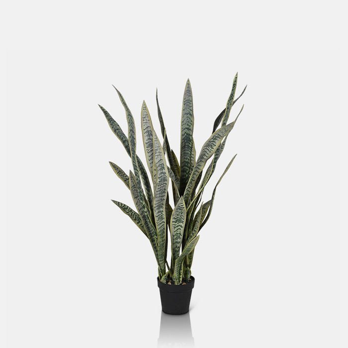 A cutout of the Artificial Snake Plant in Pot, a tall faux plant with long light green pointed leaves in a small dark grey pot.