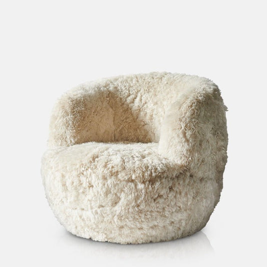 Round sheepskin armchair in cream