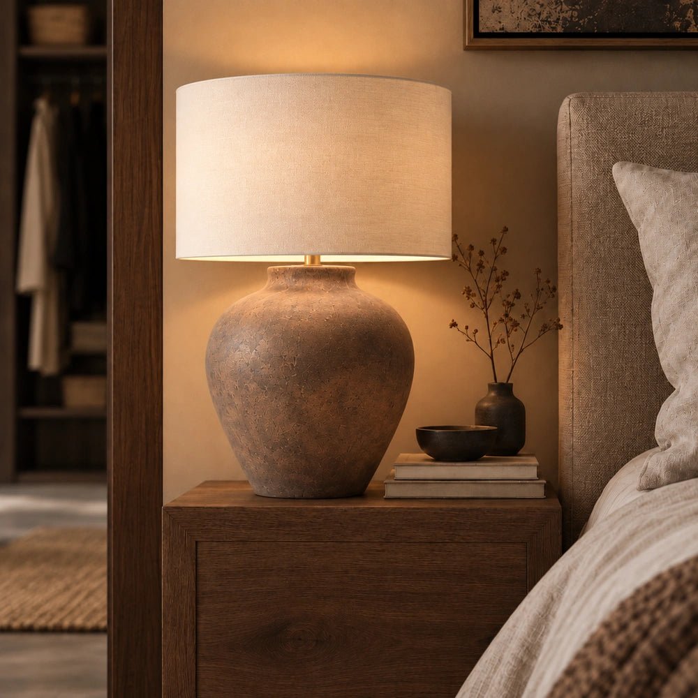 Somerdale Ceramic Table Lamp with rounded textured base and pale drum shade, styled on a small side table beside a cream faux fur chair.