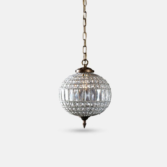 Small round clear glass chandelier with bronzed metal frame.