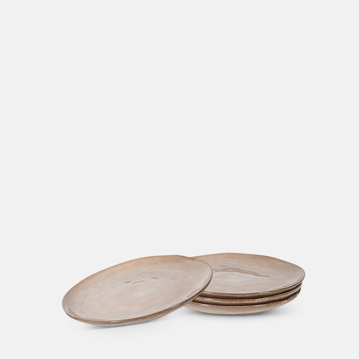 A cutout of Tirana Stoneware Dinner Plate - Set of 4, a set of four brown stoneware dinner plates with organic uneven form.