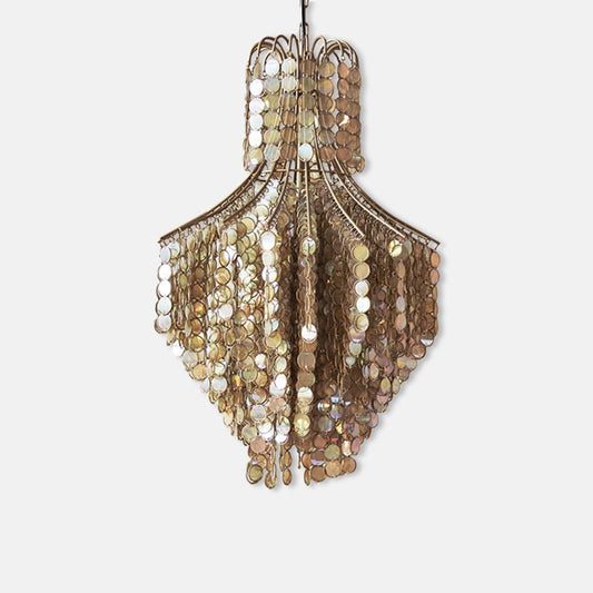 Cutout of a large hanging golden chandelier with iridescent beads in a disc shape. Buy now, pay later with Klarna.