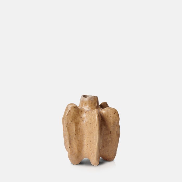 Abstract star-shaped bud vase in a light orange glaze with brown speckles