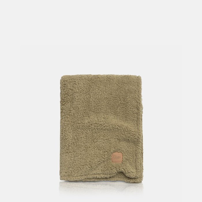 A cutout of the Winona Blanket - Sage, a large super-soft and snuggly throw in a sage green hue.