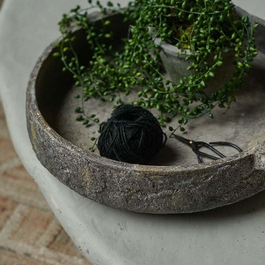 Large round textured grey bowl filled with a potted plant, ball of string and a pair of scissors. Shop now from Abigail Ahern, rated excellent on Trustpilot.