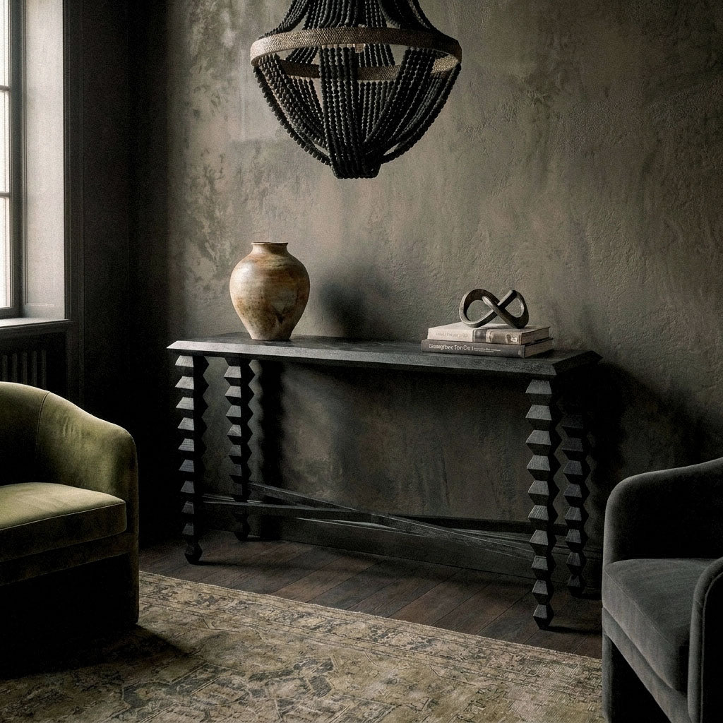 Abigail Ahern Antrim Wooden Console Table showcasing the natural grain and warm tones of the mango wood surface, styled with decorative objects to create an elegant interior vignette.