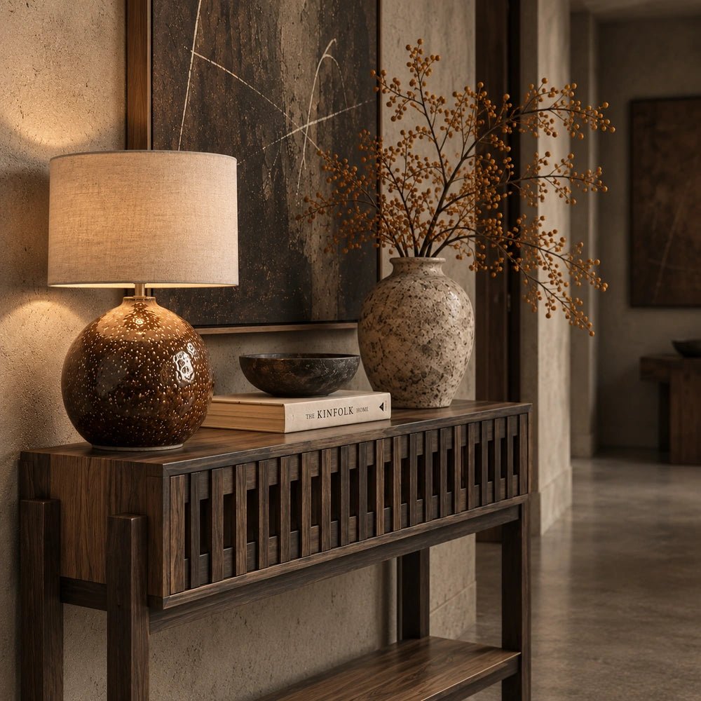 Batten Wooden Console Table styled in a warm hallway, showing its slatted wood front and dark brown finish with lamp, books and decorative vase.