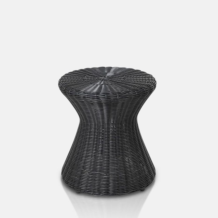 The Black Tomo Wicker Stool, a stool in a twisted cylindrical shape made from woven black wicker.