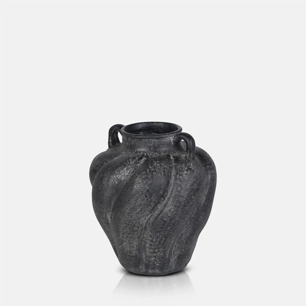 Braddock Magnesium Vase with a dark textured finish, rounded body, narrow opening and two small curved handles, shown upright to reveal its sculptural silhouette.