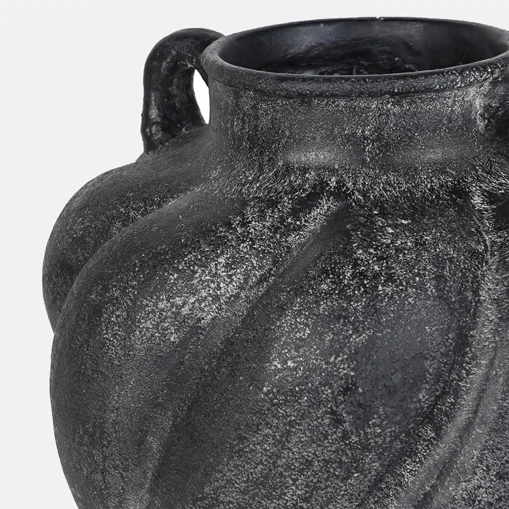 Braddock Magnesium Vase showing its dark mottled surface, narrow rim and curved handle, with a close view highlighting the raised texture and rounded shoulder.