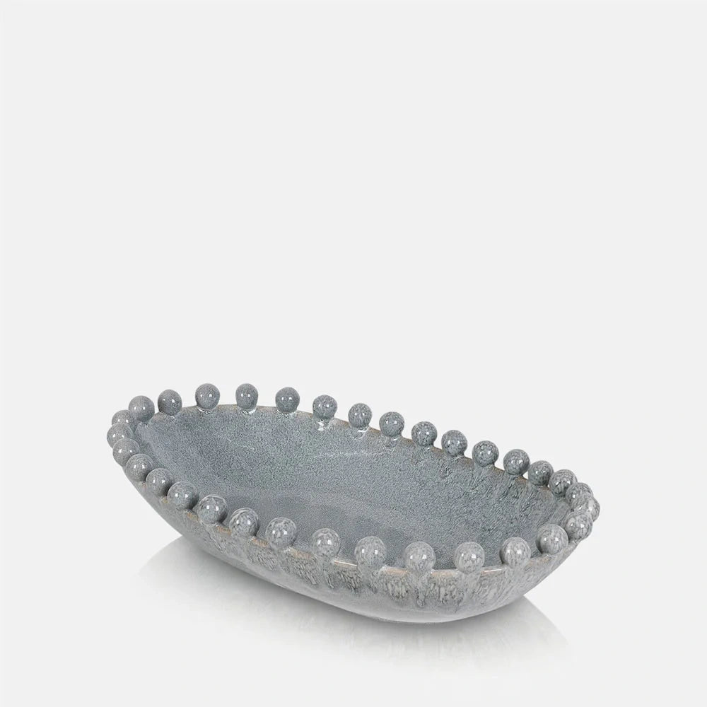 Brigham Bobble Decorative Bowl with a shallow oval shape, mottled grey glaze and rounded beads framing the rim, shown from an elevated angled view.