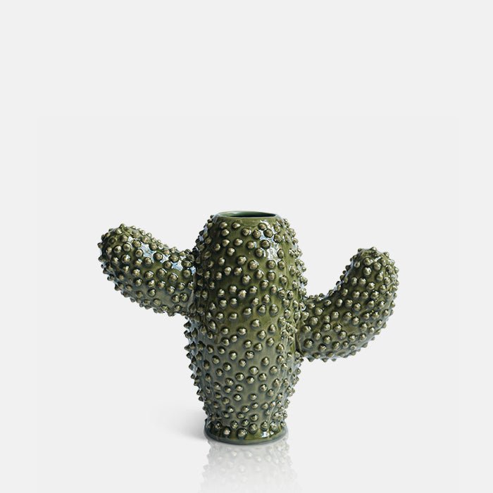 Cutout image of a green ceramic cactus vase with a raised pebble texture.