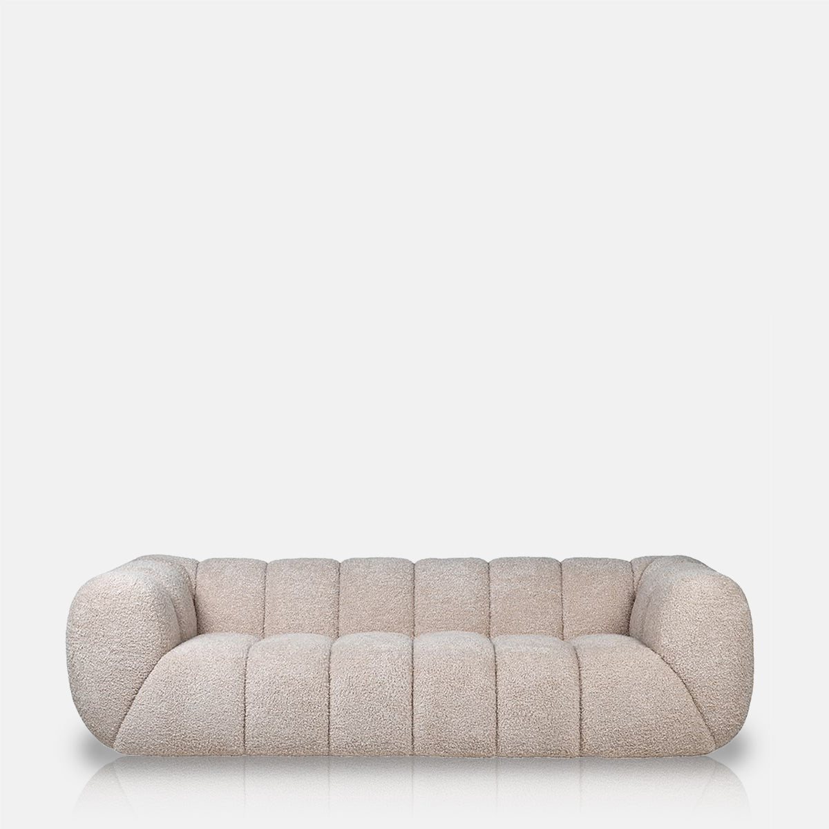 Luxury beige 3 seater sofa with a plush upholstered finish and sculptural modern silhouette. Cheverell 3-Seater Sofa by Abigail Ahern, designed with a soft neutral fabric and generous proportions for ultimate comfort and relaxed living. A statement contemporary sofa perfect for modern living rooms, luxury interiors and cosy lounge spaces, adding timeless elegance, texture and sophisticated style to your home decor.