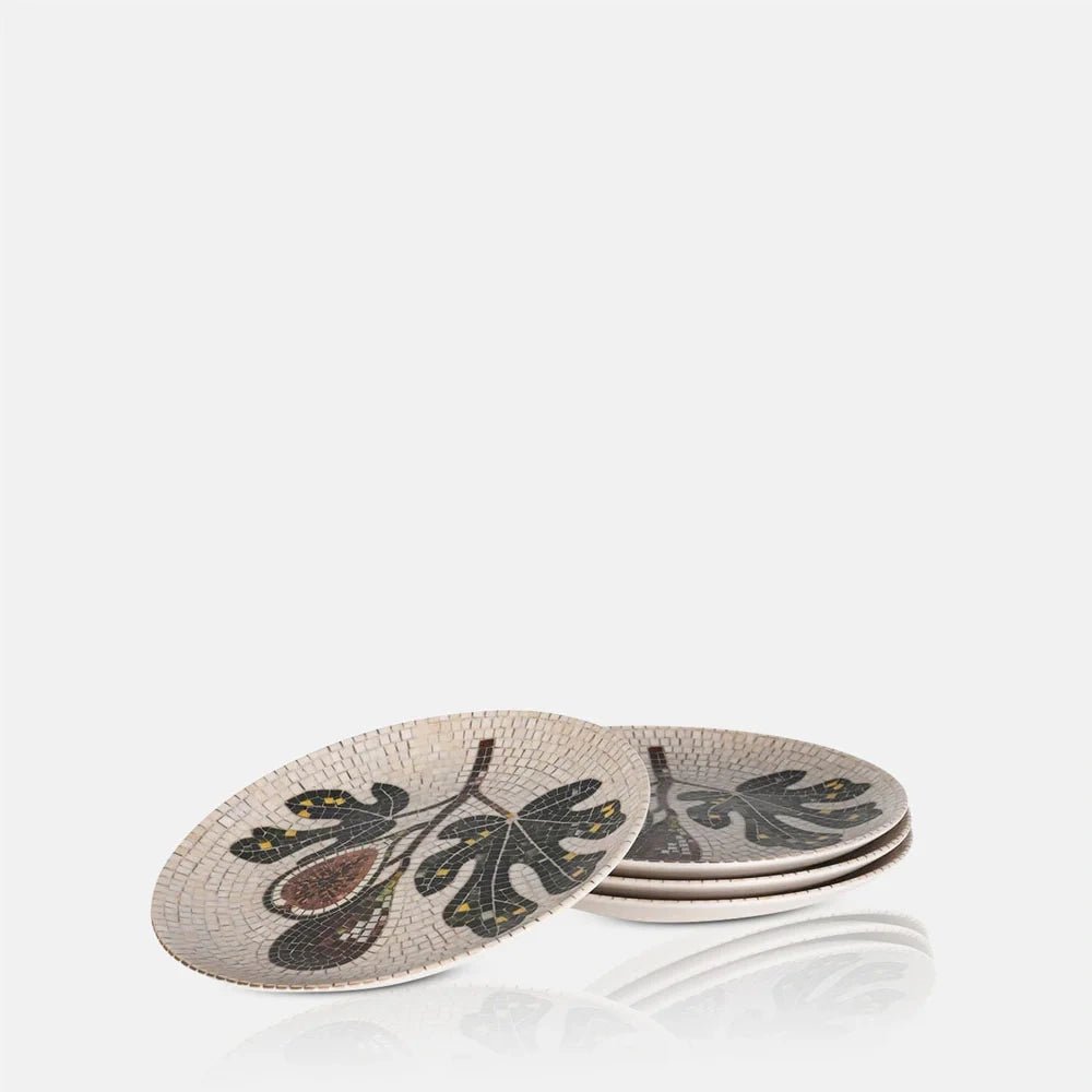 Corbett Mosaic Dinner Plates feature fig and leaf motifs in earthy colours, shown as a layered stack with one patterned plate leaning behind.