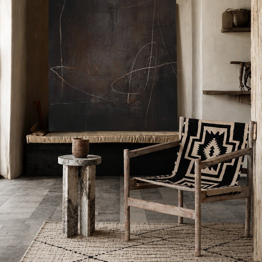 Abigail Ahern Dallas patterned sling chair with Kilim fabric seat and solid acacia wood frame in a rustic interior