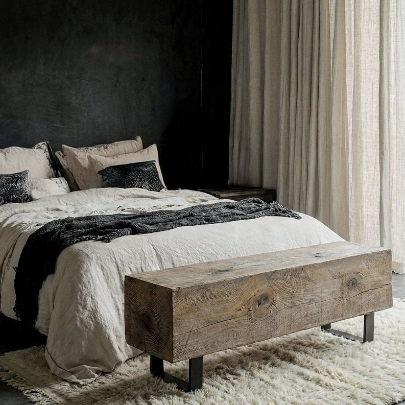 Abigail Ahern Darby Bench with a realistic wood-effect finish and industrial-style black metal legs, styled in a bedroom.