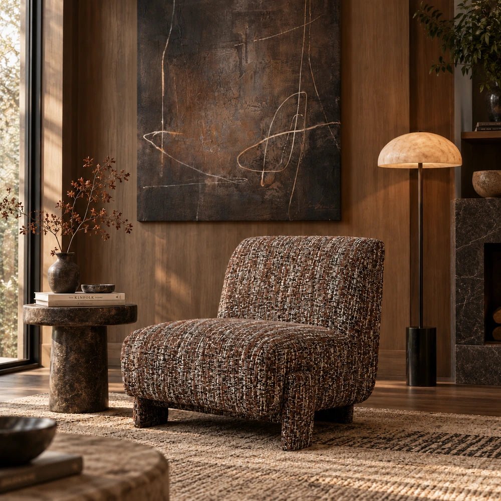 Darell Boucle Accent Chair beside large abstract artwork and a floor lamp, showing its rounded shape and richly textured brown upholstery.