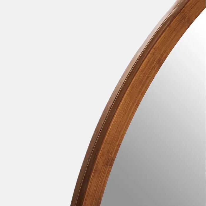 A closeup of the antiqued gold effect frame on the Dilman Mirror.