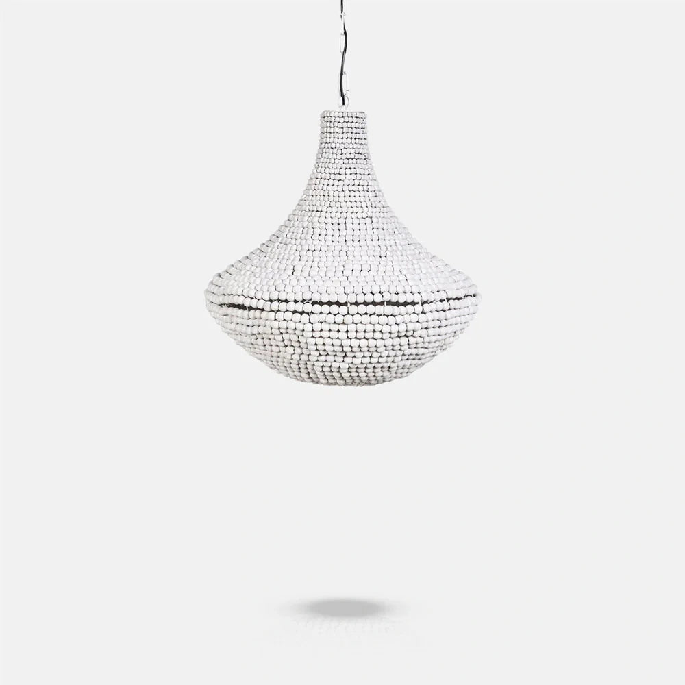 Eloise Beaded Chandelier has a tapered upper section and rounded lower body, covered in pale beads and suspended from a chain above.