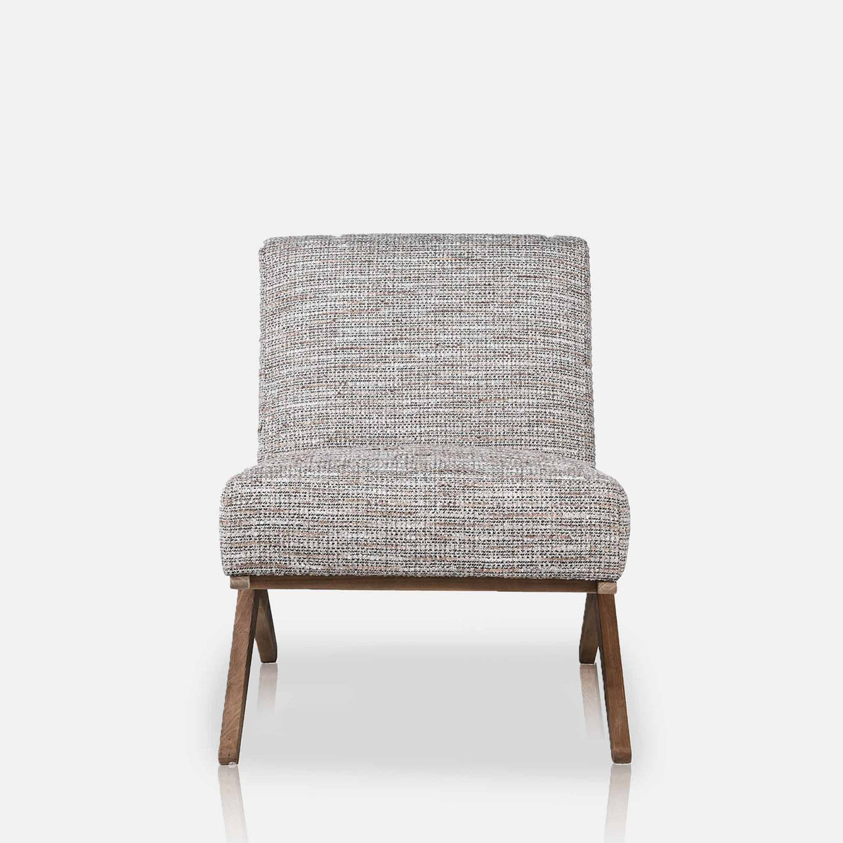 Abigail Ahern Exbury Modern Armchairs in soft grey patterned upholstery, featuring low angled silhouettes, wide cushioned seats and wooden legs