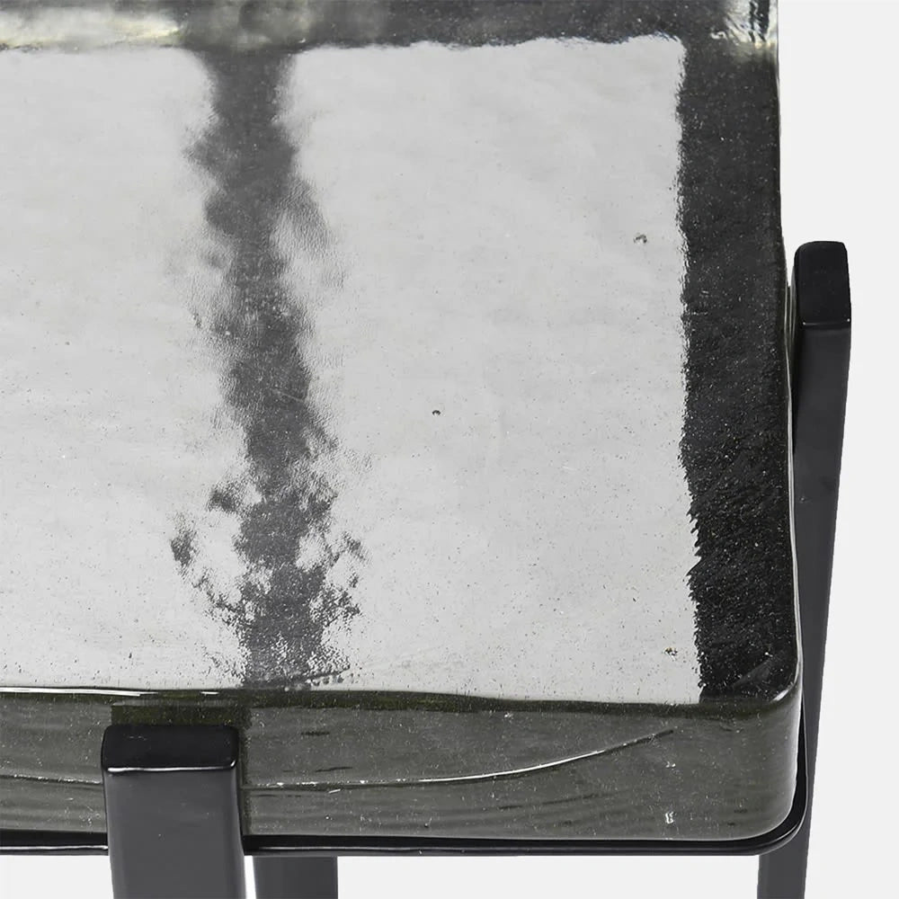 Fordham Glass Side Table detail highlights its rippled glass surface, dark edging and corner support, showing the contrast between textured glass and metal frame.