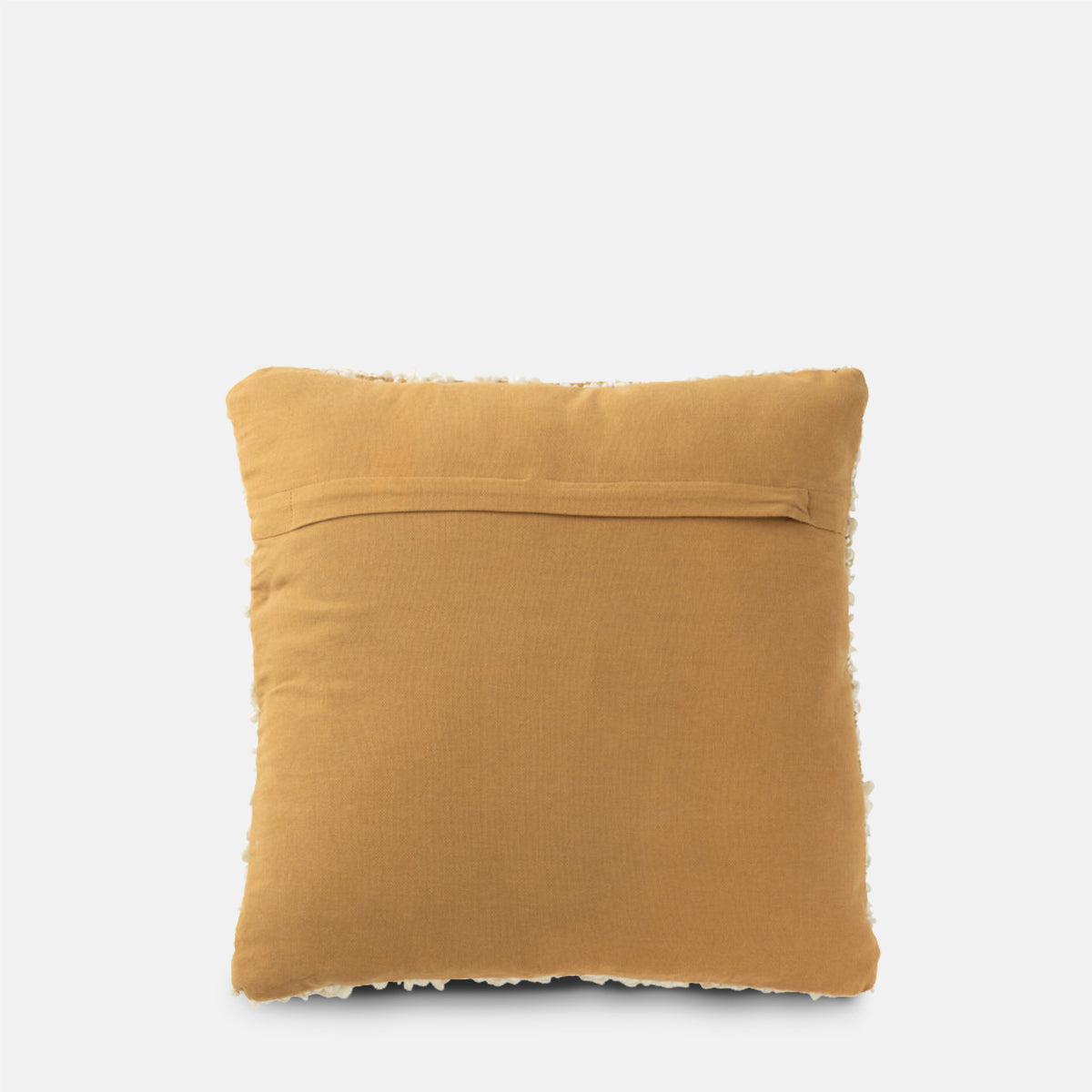 A back view of the Hallet Boucle Cushion showing the plain warm brown fabric and zip hidden under a pleated seam.