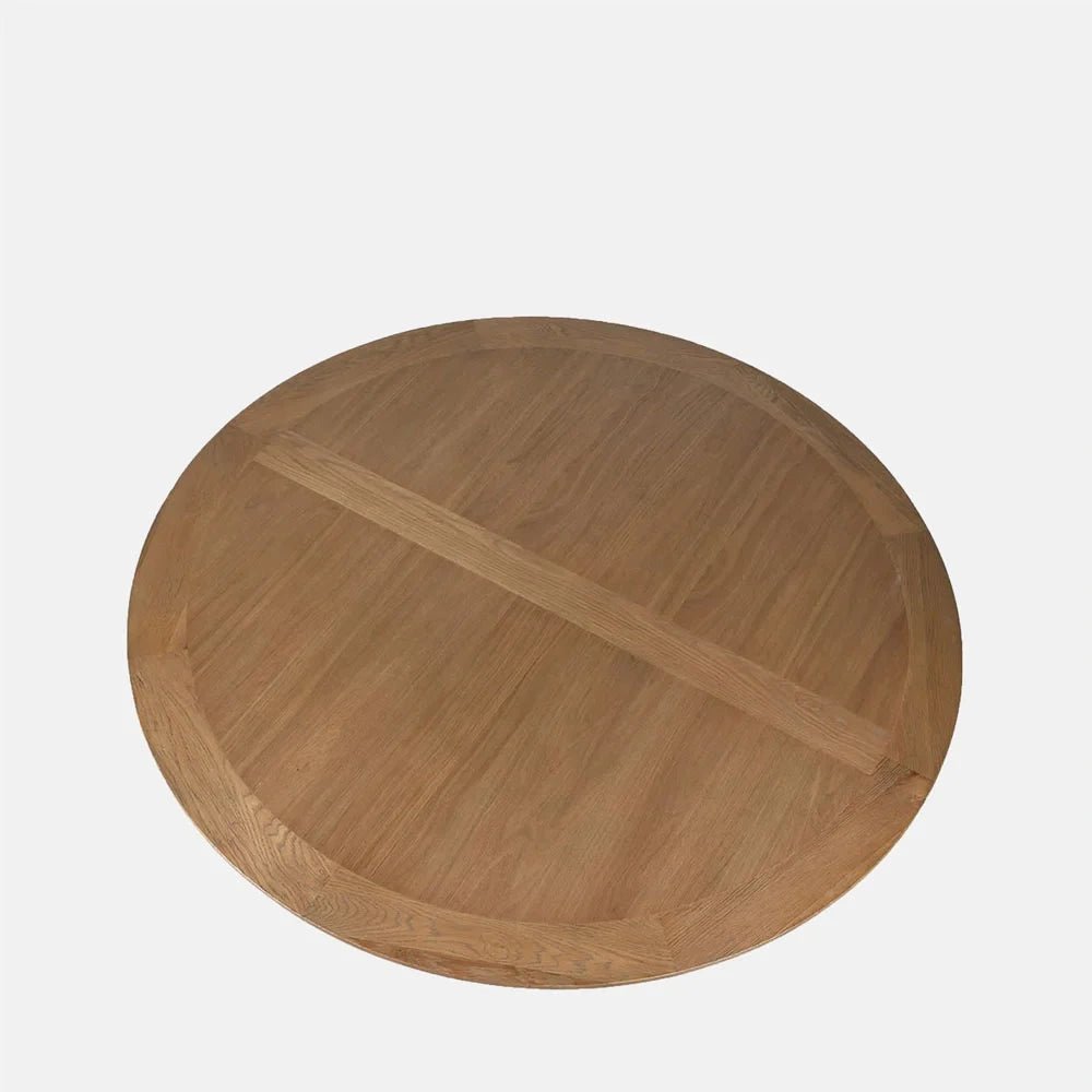 Harrington Wooden Dining Table shows a round tabletop with contrasting sections of natural wood grain and a straight central band, viewed from directly above.