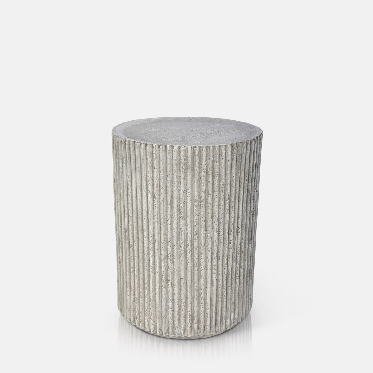 Hereford Stone Side Table by Abigail Ahern with a sculptural stone-effect finish and lightweight design, suitable for adding texture indoors or outdoors.