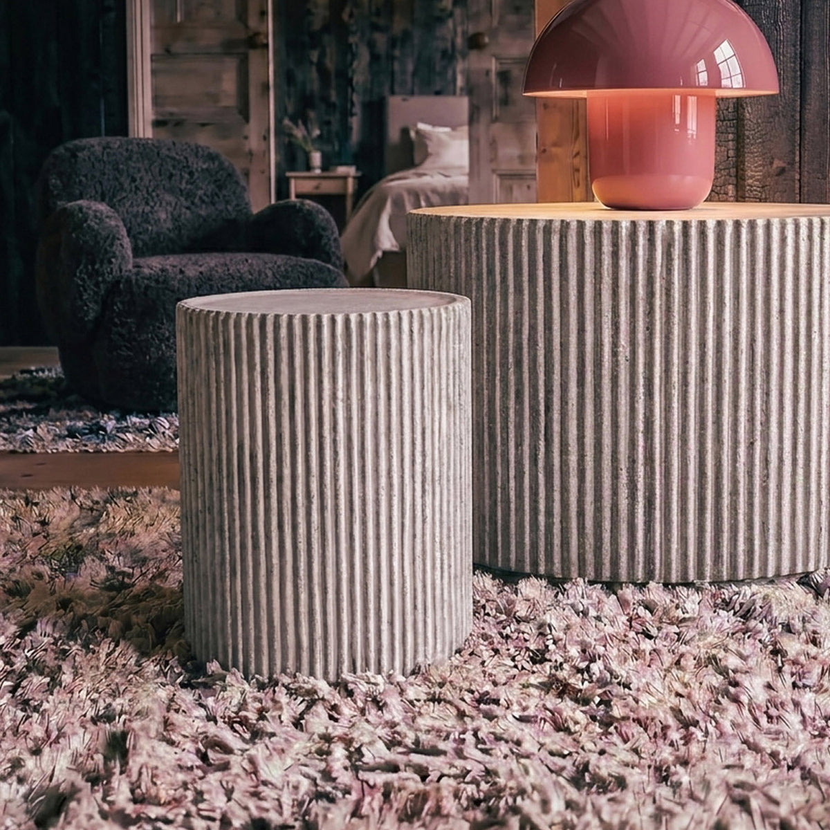 Hereford Stone Side Table by Abigail Ahern with a sculptural stone-effect finish and lightweight design, suitable for adding texture indoors or outdoors.