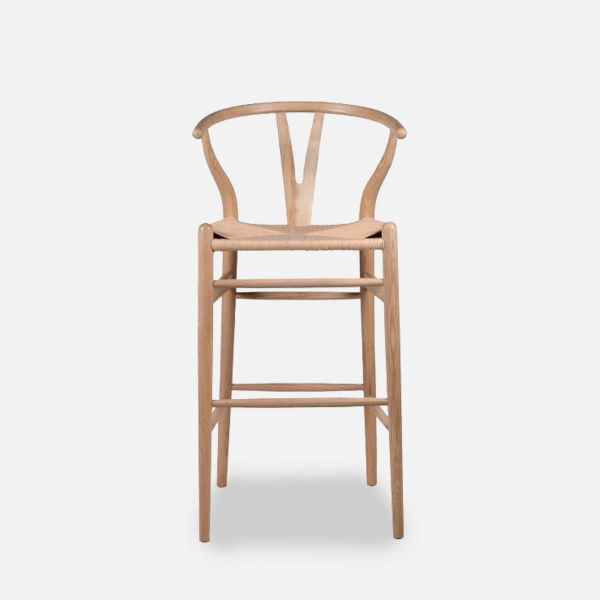 The Hurst Wishbone Bar Stool, a classic design in a light wood with a woven seat.