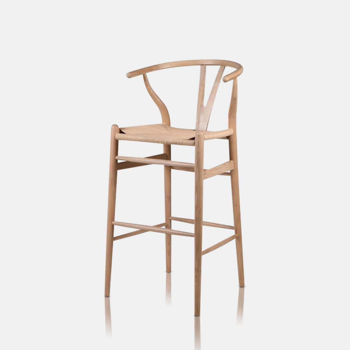 The Hurst Wishbone Bar Stool, a classic design in a light wood with a woven seat.
