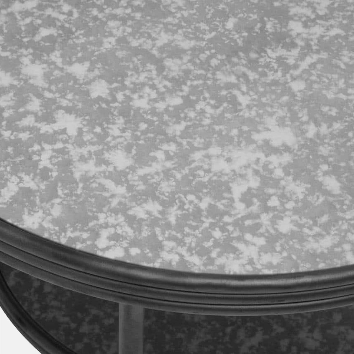 Close-up of the Abigail Ahern Leiden Coffee Table highlighting the softly aged antique mirrored glass tabletop and simple metal frame.