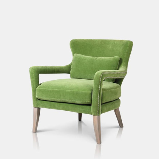 The Linton Studded Club Chair is a beautiful apple green coloured chair, with a velvety fabric, wooden legs, and a classic studded detailing,