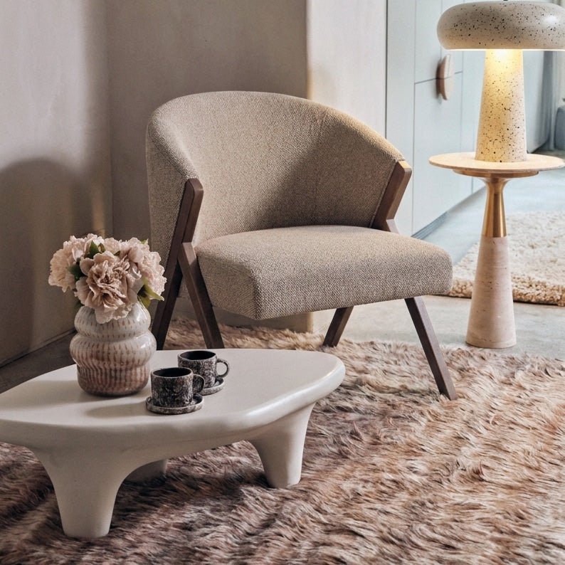 Abigail Ahern Lyndon Upholstered Dining Chair featuring a softly curved back, generously padded seat and sturdy wooden frame comfortable and stylish for around a coffee table.