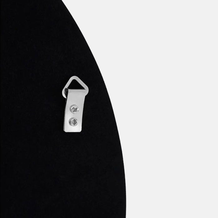 A closeup of the back of the Medium Della Mirror, showing a small metal hook to hang it with.