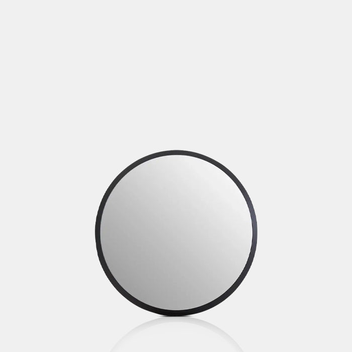 The Medium Della Mirror, a round modern contemporary mirror with a smooth black MDF frame.