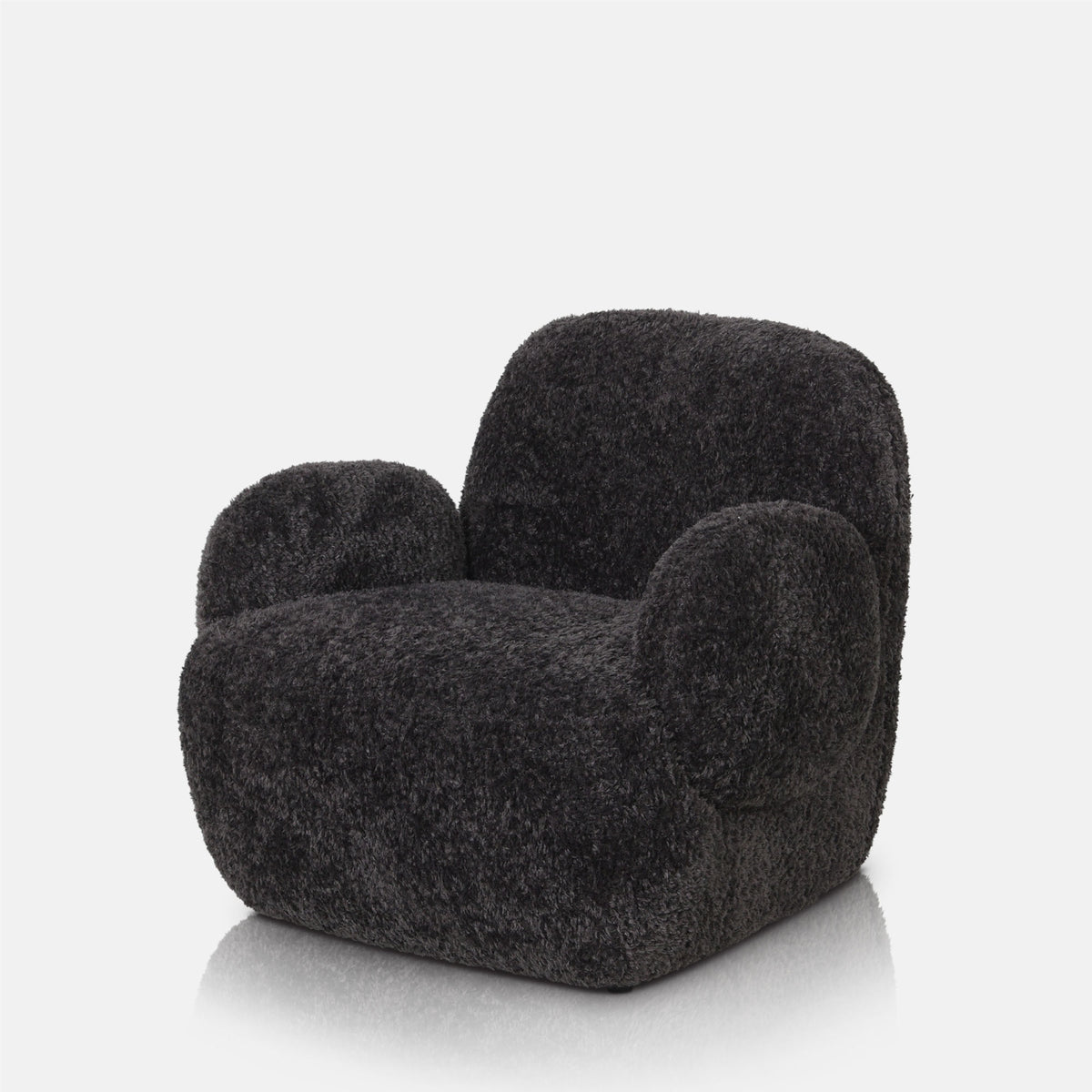 Cut out of the Abigail Ahern Natasha Faux Fur Armchair in rich charcoal grey, featuring a generously rounded silhouette with a curved back and softly padded seat. Upholstered in tactile faux shearling with a plush, textured finish, this statement armchair brings warmth, softness and contemporary character to a living room or bedroom.