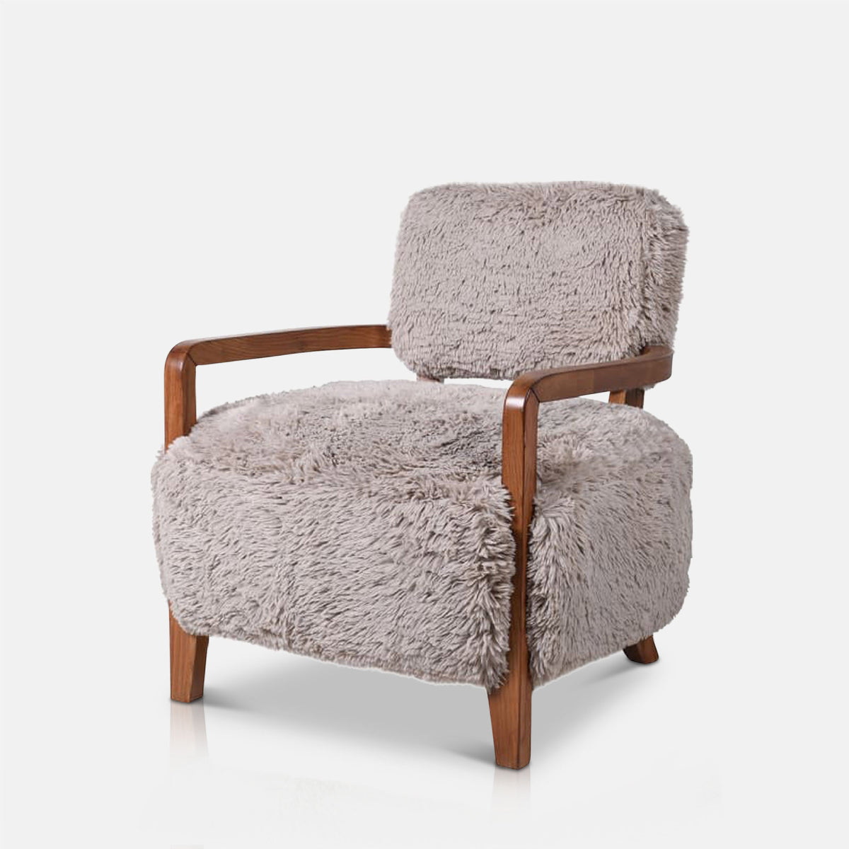 Luxury faux fur armchair featuring a soft textured upholstery, rounded sculptural silhouette, and contemporary organic design with exposed wooden arms complimenting warm neutral tones for modern living spaces.