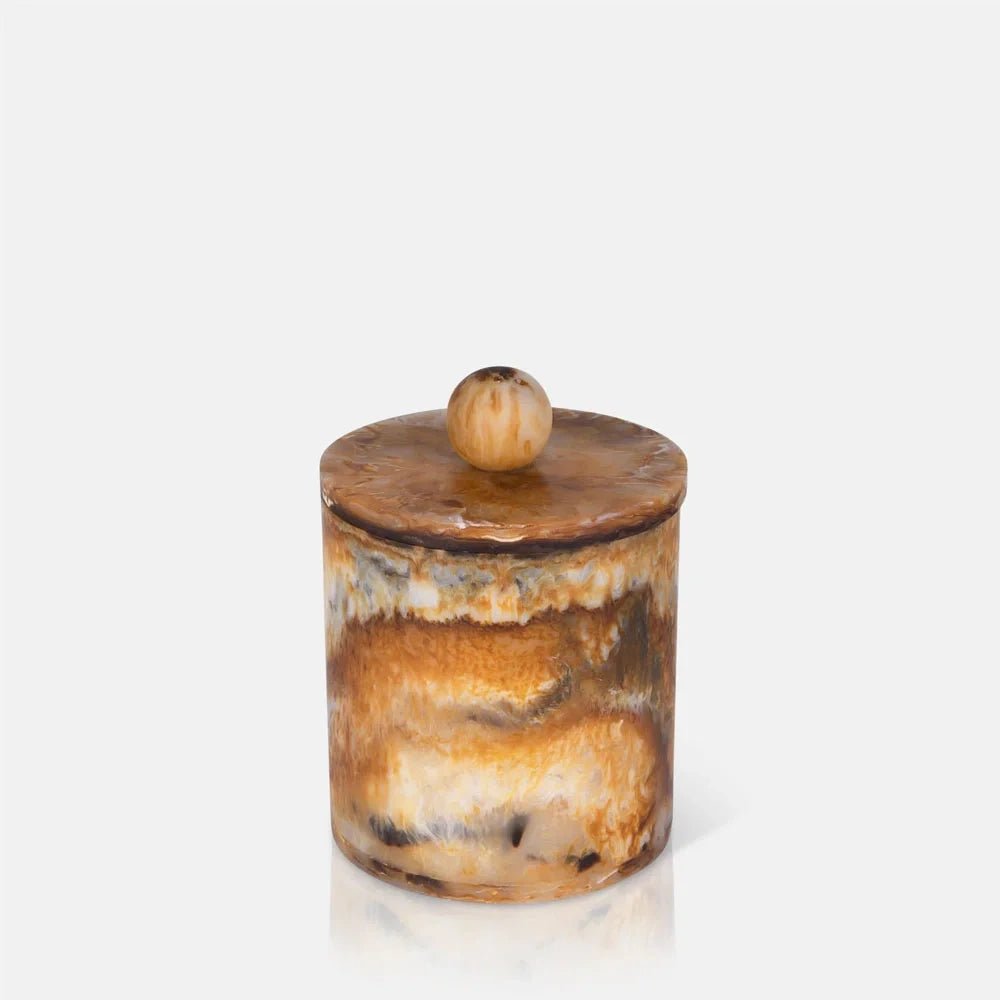 Reeve marble effect jar with a cylindrical body, fitted round lid and spherical knob, featuring layered amber, cream and dark mottling across its glossy surface.