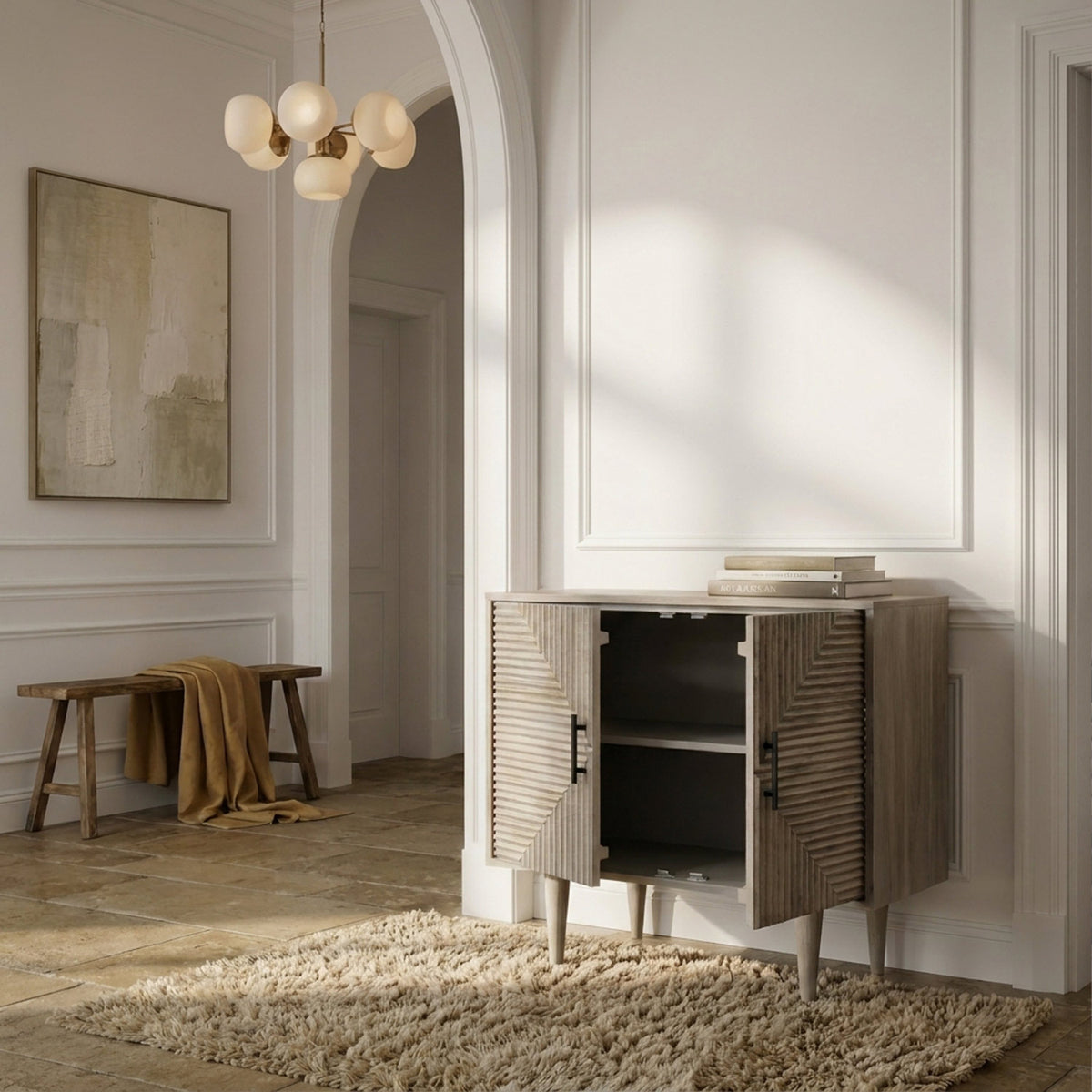 Abigail Ahern Rushmoor Wooden Sideboard in natural mango wood with carved geometric detailing across two doors, offering stylish storage for contemporary hallways.