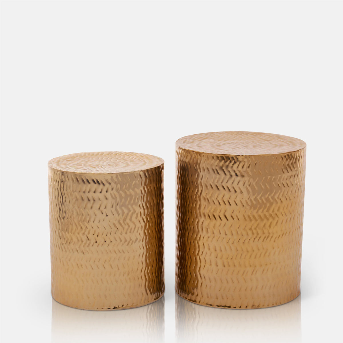 Abigail Ahern Salado Side Tables in a metallic gold finish with distinctive etched chevron patterns, comes as a pair these are versatile sculptural occasional tables.