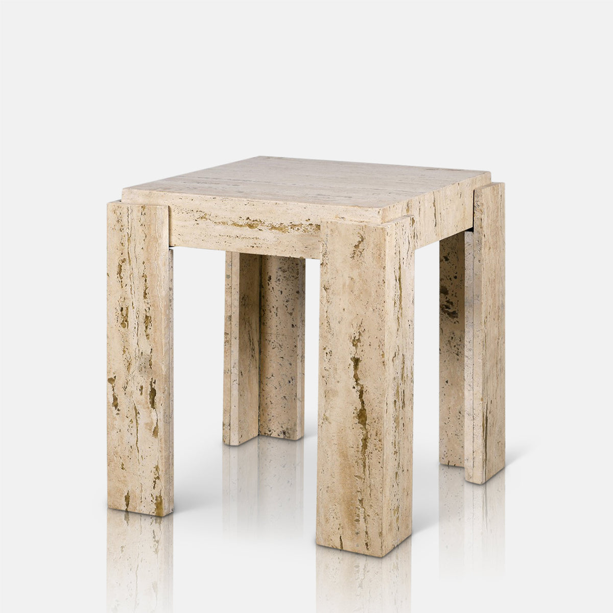 Abigail Ahern Santa Travertine Side Table in a soft-hued cream stone finish, styled modern but sophisticated occasional table