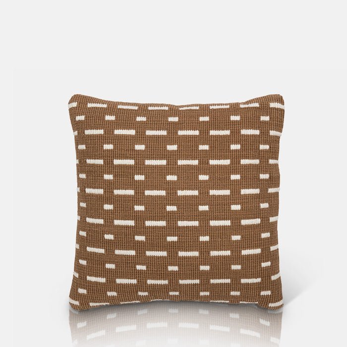 A cutout of the Soriano Cushion, a square cushion with a woven cover in a rich earthy brown with white line detail.