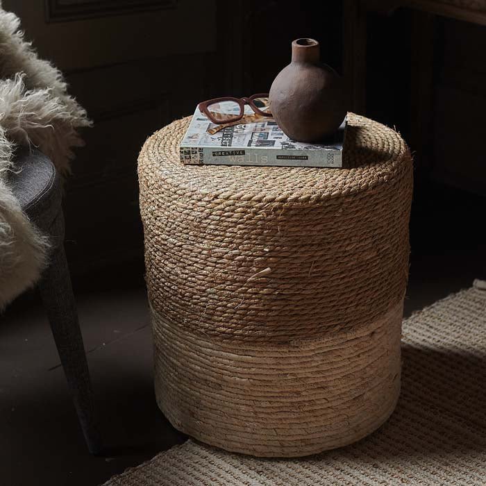 The Hadlow Woven Rope Stool, a cylindrical stool covered in rope in a two tone cream and natural colourway.