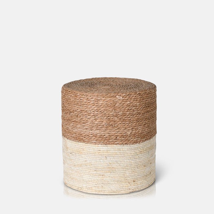 A cutout of the Hadlow Woven Rope Stool, a cylindrical stool covered in rope in a two tone cream and natural colourway.