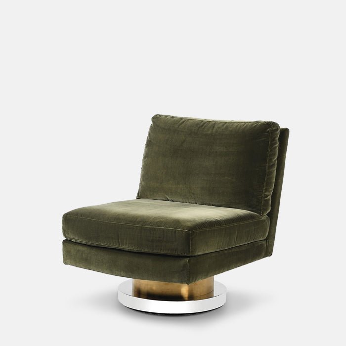 Abigail Ahern Lilian Velvet Swivel Chair in olive green velvet with a plush square-shaped seat and backrest, set on a contemporary brass-toned pedestal swivel base for a glamorous modern look.