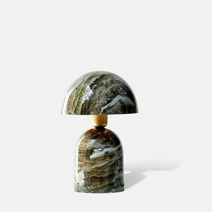 Brown and white faux marble table lamp with curved dome shade and base.