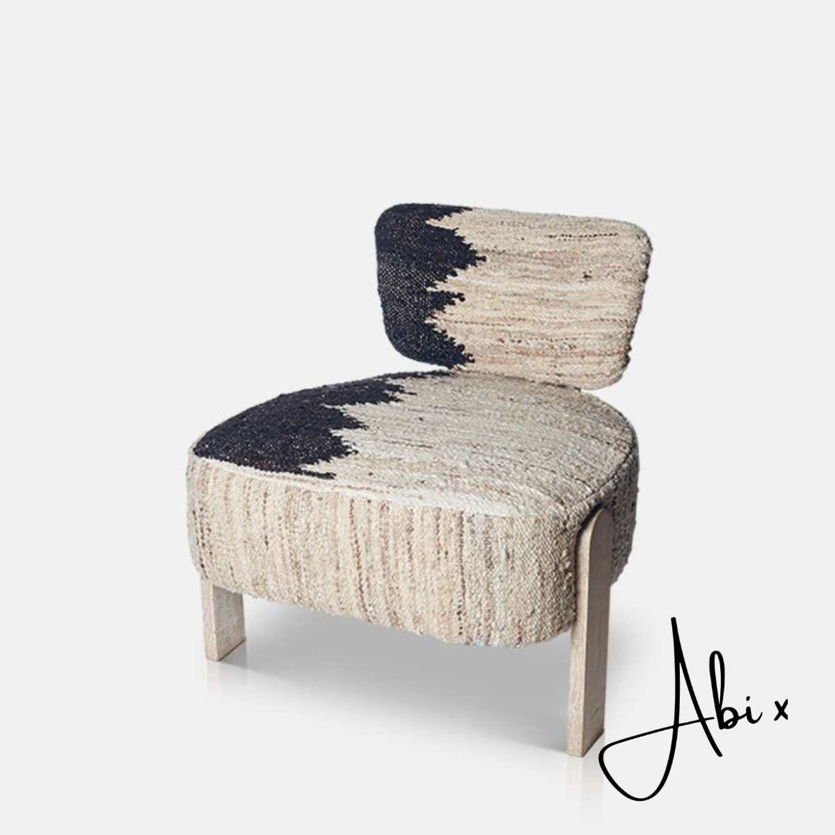 Cream and slate gray real wool occasional chair with a soft textured upholstery, geometric woven pattern and natural solid oak wooden base. Osaka Occasional Chair by Abigail Ahern, featuring a contemporary sculptural design with a neutral colour palette that adds warmth and character to modern interiors. A luxury accent chair perfect for living rooms, bedrooms, dining spaces and cosy reading corners, bringing comfort, texture and timeless designer style to your home decor.