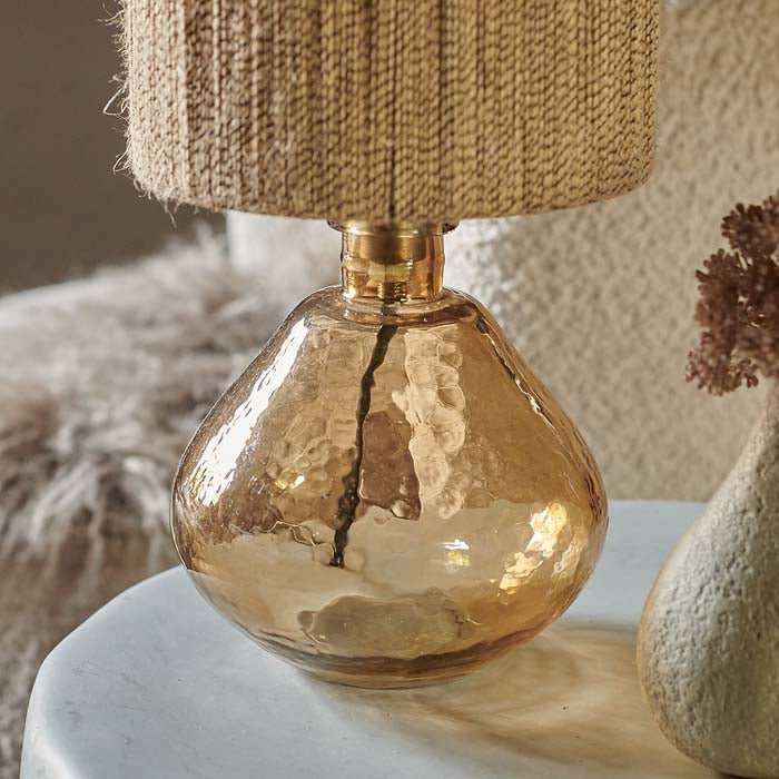 Amber glass lamp base with organic recycled look.