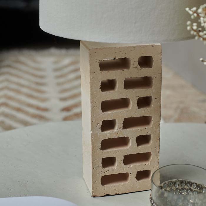 Warm beige brick table lamp base with cut-out design.